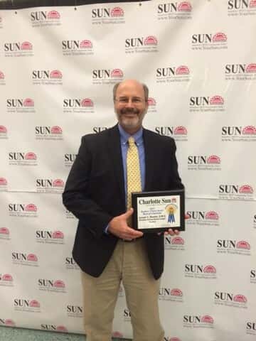 Dr. Bender with Readers' Choice Award.
